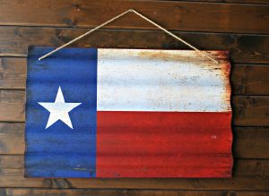 A metallic Texas flag hung on a wooden wall in solidarity for those affected by Hurricane Harvey.