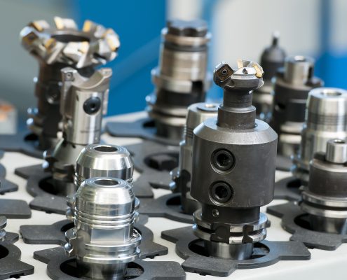 A close up of various machine tool heads not currently in use by a machine, which can be kept track of with Predator Tracker software.