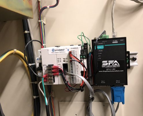 A 2-Port Wired Ethernet Connect with 1 port in use is wired to a Predator MDC Status Relay Controller to collect data from the machine they're connected to.