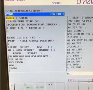 A close up shot of the screen of a Doosan controller, showing the G-code produced by CAD CAM software.