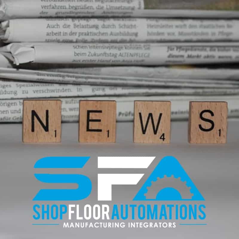 Shop Floor Automations logo overlaid on top of a photo of four letter blocks spelling "News" and a stack of newspapers in the background.