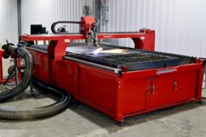 A Dynatorch plasma cutting machine at work, one of the many types of machines that are compatible with machine monitoring technology.
