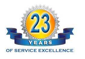 A gold medal with a blue ribbon that says "23 Years of Service Excellence"