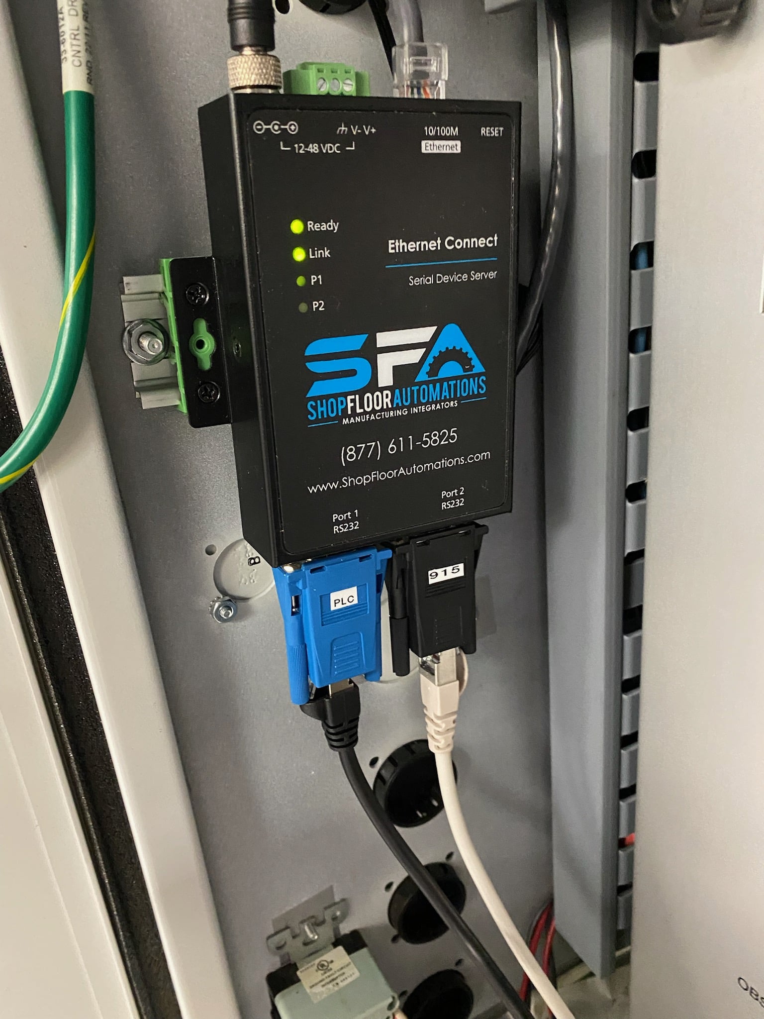 A Wired Ethernet Connect with 2 ports is mounted and plugged into a machine, giving the machine ethernet capability.