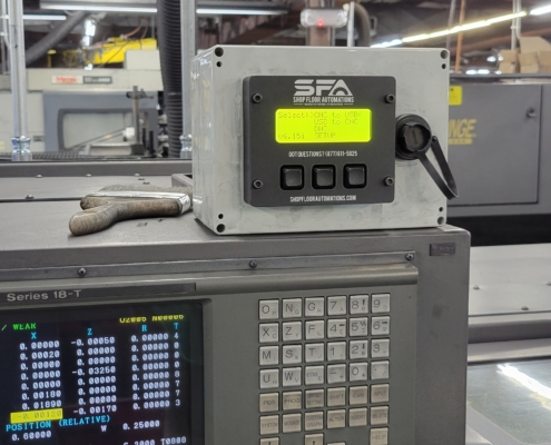 A LAN USB Connect attached to a switch box to control data flow between the CNC machine and computer.