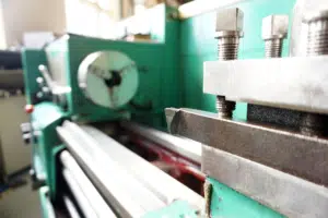 A close up of a lathe, one of many machines that are compatible with machine monitoring software.